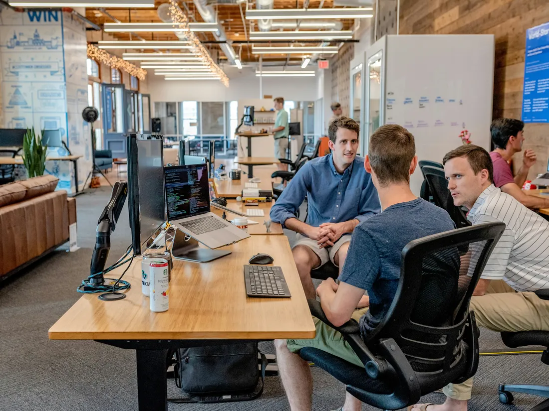 Technology team collaborating around a table